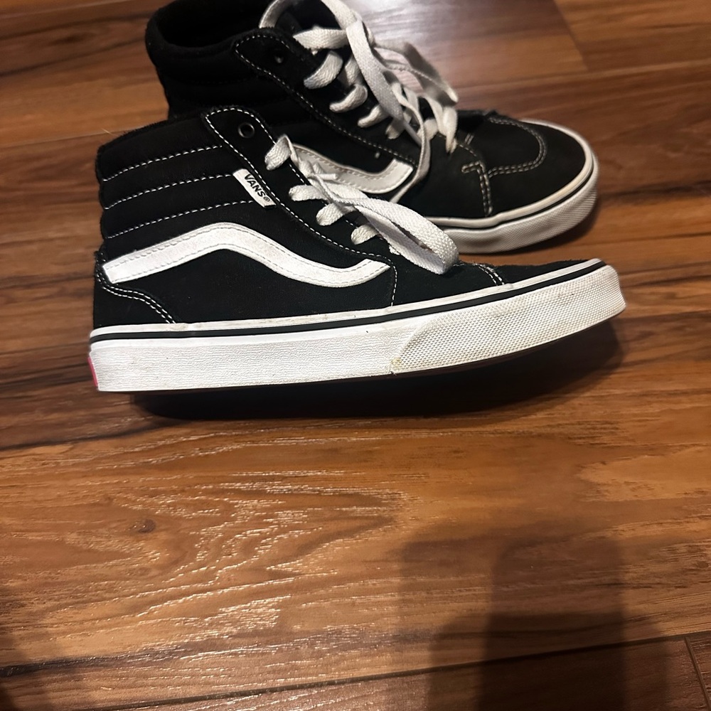 Vans Black Sneakers with High-Top Design and White Accents